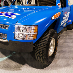 Off-road racing truck parked on RaceDeck Diamond