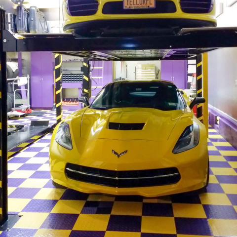 Yellow-purple themed garage with Corvettes