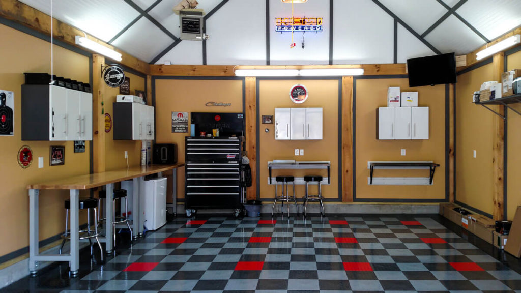 A clean garage in RaceDeck Diamond garage flooring tile with TuffShield®