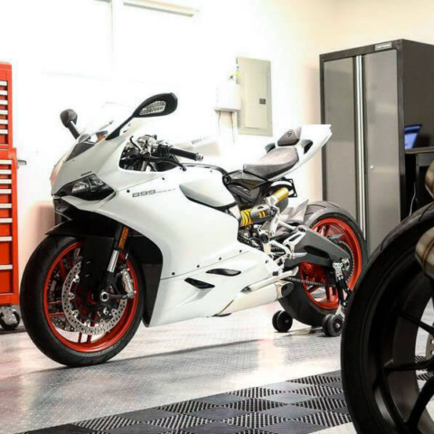 Motorbikes in a garage with lots of natural light