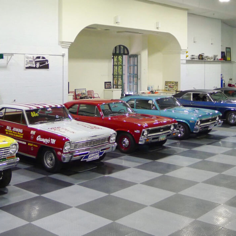 Huge car collection in a graphite and alloy color garage