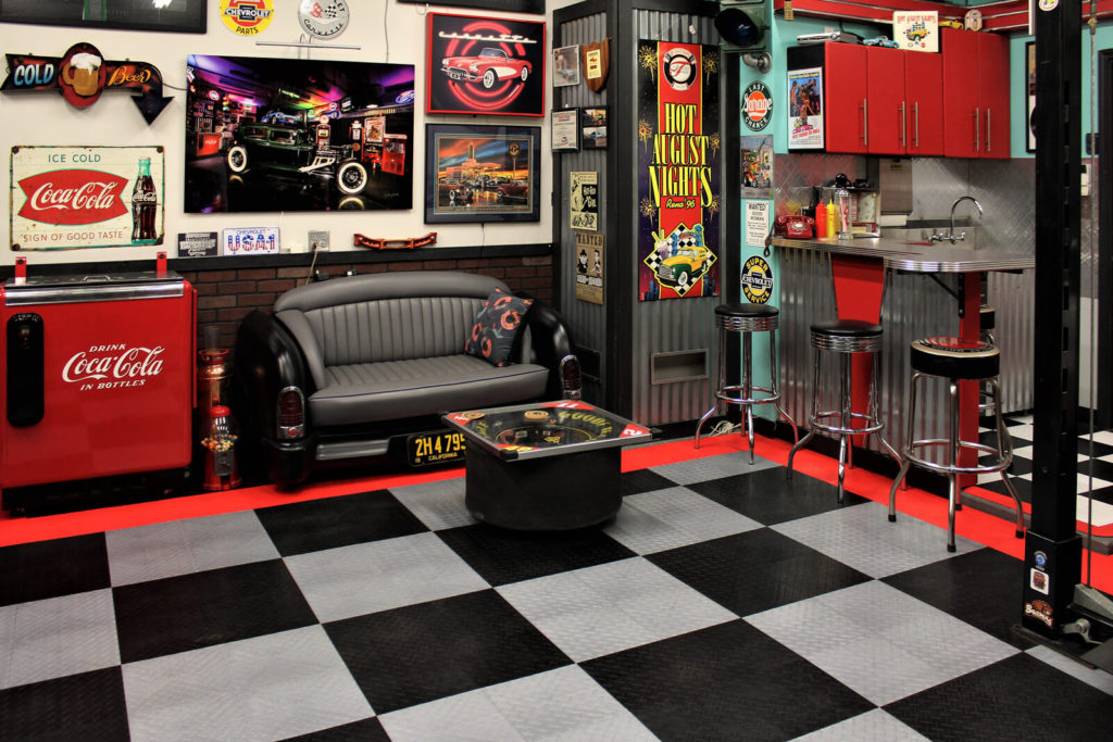 Tony Dekellis - Seating area with 51 Mercury couch and NASCAR tire table