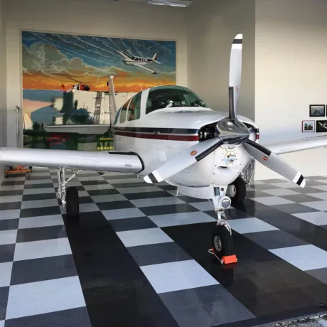 airplane in hanger with racedeck flooring