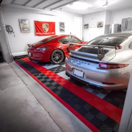two porsche in garage on freeflow